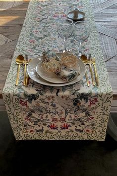 a table set with plates and silverware on it