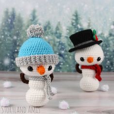 two crocheted snowmen wearing hats and scarves