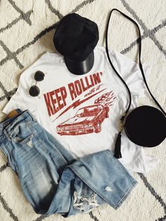 Keep rollin' with it. Our newest collection of graphic tees! With distressed, vintage style prints, these are your new go-to wardrobe staple. #graphictee #vintagetshirt #graphictshirt Retro Graphic Design T-shirt For Spring, Trendy Fan Merchandise T-shirt With Screen Print, Graphic Tee Tops For Fan Merchandise, American Retro Graphic Print T-shirt For Summer, American Retro Graphic T-shirt For Summer, American Retro Graphic Print Tops, Trendy Short Sleeve T-shirt With Vintage Print, Casual Tops With Vintage Print For Fan Merchandise, American Retro Crew Neck Top With Graphic Print