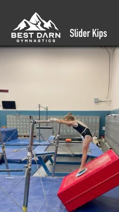 a person on a balance beam in a gym