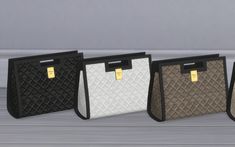 three purses with tags on them sitting next to each other in front of a wall