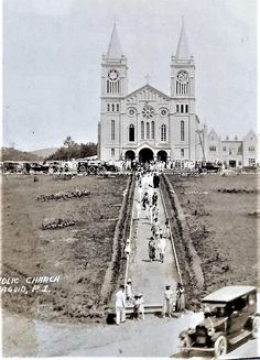 an old black and white photo of people in front of a church