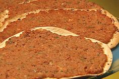 three pizzas sitting on top of a blue plate