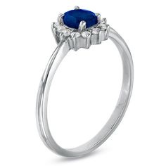 A princess-perfect look, give the September-born birthday girl a gift fit for royalty! Beautifully fashioned in elegant 10K white gold, this ring features a striking 5.0 x 4.0mm oval-shaped blue sapphire gemstone bordered with a sparkling frame of diamond accents. Simple yet oh-so-stunning, this brightly polished ring is certain to become a go-to look she'll adore. Formal Birthstone Ring With Halo, Formal Halo Birthstone Ring, Halo Birthstone Promise Ring, Formal White Gold Halo Ring With Birthstone, September Born, Blue Sapphire Gemstone, Blue Sapphire Diamond, Girl A, Sapphire Gemstone