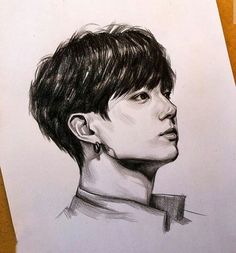 a pencil drawing of a person with short hair