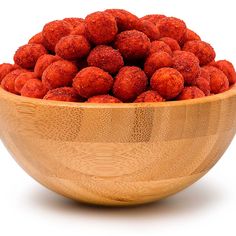 a wooden bowl filled with lots of red food