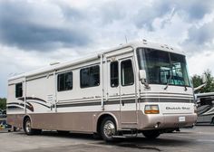 a motor home parked in a parking lot