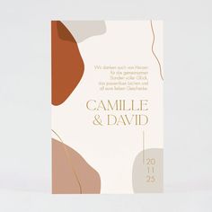 a wedding card with an abstract design