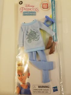 the packaging for this doll is packaged in blue and has an image of princesses on it