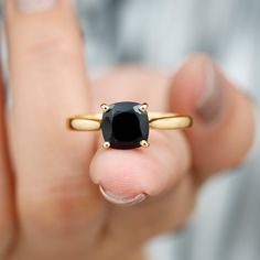 Product Details Look stylish while flaunting this Black Onyx Solitaire Ring adorned with a Cushion Shape Black Onyx in 4 prong setting while a hidden Round Shape Diamond graces its shank in bezel setting. Gift this stunning Solitaire Ring crafted in Solid Gold to your better half on a special day and win her heart right away. Product Information SKU SHP-RINGS122040918 Width 7 mm Height 8.5 mm Weight 2.64 gm (Approximate) BLACK ONYX INFORMATION No.of Stones 1 Pieces Total Weight 2.10 Carat (Appro Ring Crafts, Black Spinel, Signature Jewelry, 18k Yellow Gold Ring, Cushion Cut, Timeless Jewelry, Conflict Free Diamonds, Solitaire Ring, Black Onyx