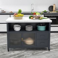 a kitchen island with plates and bowls on it