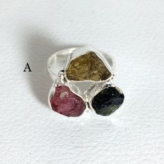 Handmade Artisan 925 Solid Sterling Silver RING with Watermelon Tourmaline RING - DETAILS: A - size 6.75 , 20x20 mm B - size 6 , 22x18 mm ( All sizes - us ) MATERIAL: Solid Sterling Silver MAIN STONE: Watermelon Tourmaline OTHER STONES: Multi Colour Tourmaline STAMP / MARK: 925 CONDITION: New #3010 Only one piece available and ready to ship We bring to you the best quality exclusive handcrafted jewelry. All of these pieces are one of a kind handmade by our artisan team. Each photograph is of the Tourmaline Natural Stones Ring Jewelry, Tourmaline Ring With Natural Stones, Tourmaline Natural Stones Ring, Rough Gemstone Jewelry, Watermelon Tourmaline Ring, Rainbow Moonstone Ring, Gemstone Jewellery, Tourmaline Ring, Watermelon Tourmaline