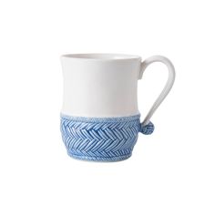 a blue and white coffee cup on a white background with a rope around the bottom