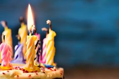 several candles are lit on a birthday cake