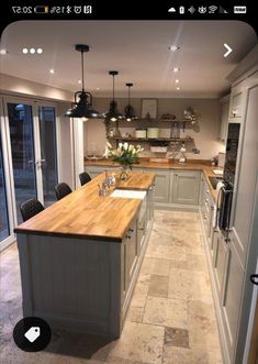 an image of a kitchen setting with wood counter tops and grey painted cabinets in the background