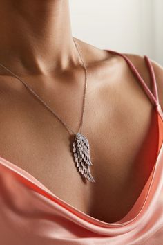 Garrard's necklace is designed to mimic the natural shape and delicacy of angel wings - each pendant is intricately crafted to move independently from another as they overlap. Cast from 18-karat white gold in an openwork design that brings "an ethereal lightness", they're illuminated with round-cut diamonds to accentuate their swooping curves and strung on an adjustable chain. Luxury Flower-shaped Diamond Necklace In Fine Jewelry Style, Elegant Wing-shaped Yellow Gold Necklace, Elegant Yellow Gold Wing-shaped Necklace, Elegant Silver Wing-shaped Jewelry, Elegant Wing-shaped Silver Jewelry, Elegant Wing-shaped White Gold Necklace, Elegant White Gold Wing-shaped Necklace, Angel Wings Jewelry For Anniversary, Elegant Angel Wings Jewelry