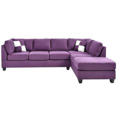 a purple sectional couch with pillows on the top and bottom corner, in front of a white background