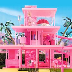 a barbie doll house with pink furniture and palm trees