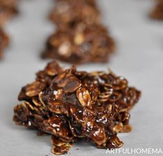 chocolate cookies with nuts are on a baking sheet