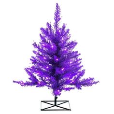 a purple christmas tree with lights on it