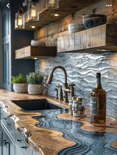 the kitchen counter is made out of wood and has blue waves on it, as well as a bottle of wine