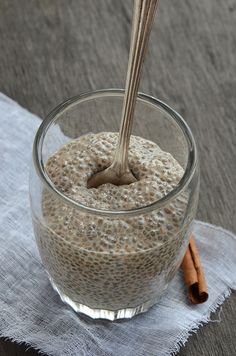 an oatmeal in a glass with cinnamon sticks