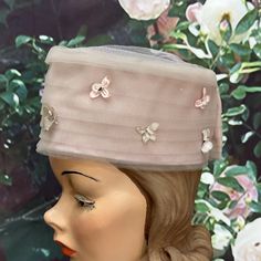 "Vintage 1960's blush pink beehive hat has pleated tulle with small silk flowers. The top of the hat is open with a layer of tulle. It measures approximately 22\" around and 4.5\" tall. Excellent condition. Please see photos for more details. All items are vintage that are preowned. All of the items may show some form of wear due to their age. Please kindly remember that these items are anywhere from 30-80 years old. I make every attempt to clearly describe the item, including any flaws or wear Spring Tulle Fascinator, Vintage Spring Wedding Headpieces, Vintage Mini Hats For Spring Evening, Vintage Mini Hats For Spring Evenings, Vintage Mini Hats For Evening In Spring, Vintage Spring Headpieces For Church, Vintage Headpiece For Church In Spring, Vintage Spring Church Headpieces, Spring Evening Vintage Mini Hats