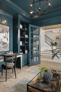 french doors, paned doors, blue-green home office, built-in shelving, built-ins home office, wicker decor, indoor trees, house plants Tray Ceiling, Franklin Tn, Rustic Chandelier, Luxury House Designs, Green Coat, New Homes For Sale, Custom Home Builders, Home Builder