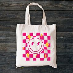 "Aesthetic Smile Tote Bag, Checkered Summer Tote Bag, Trendy Cool Canvas Bag, Positivity Bag, Tumblr Tote Bag, Canvas Bag, Zippered Tote Bag Welcome to ZeeShirtUS! I am happy to see you in my shop. My main purpose is to meet you with a high-quality product. The regular and zippered tote bags are perfect for just about anything. Grocery bag, school bag, beach bag, a beautiful fashion bag all year round, etc. The design is only printed on one side of the bag.  How To Order 1. Please, check and rev Aesthetic Smile, Zippered Tote Bag, Summer Tote Bag, Summer Tote Bags, Summer Tote, Bag School, Zipper Tote Bag, Zippered Tote, Bag Canvas