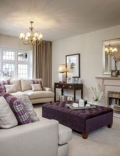 a living room filled with furniture and a fire place