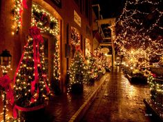 christmas lights adorn the streets of a town