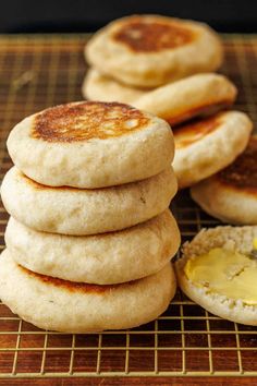 some food is sitting on a cooling rack and it looks like pancakes are stacked up