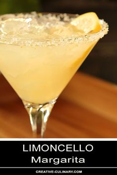 a close up of a drink on a table with a wooden surface in the background