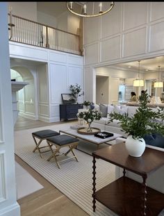 a living room filled with furniture and lots of windows