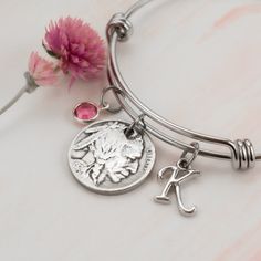 This beautiful bangle bracelet made with a genuine 1924 Nickel coin charm makes the perfect 100th birthday gift!  The bracelet is 2.5 inches wide and expands to fit over your hand.  The coin on this bracelet is polished to give it a jewel-like appearance.  You can also choose to personalize the bracelet with a Swarovski Crystal birthstone charm, an initial charm or both. Please visit my shop to see more 1924 coin items! https://www.etsy.com/shop/theanniversaryshoppe?search_query=1924 Need a different year or a combination of years? A different type of coin or even a coin from a different country? Just send me a Custom Order request! Present For Mother, 100 Birthday Gifts, Gift For Grandmother, 100th Birthday, Birth Year, Birthstone Charms, Initial Charm, 100 Years, Bangle Bracelet