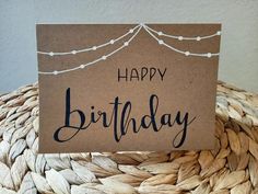 a birthday card sitting on top of a woven basket