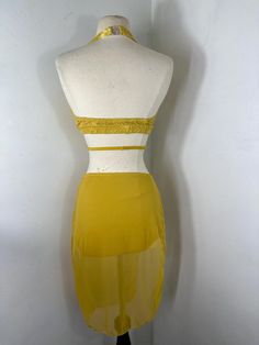 a mannequin with a yellow skirt on it