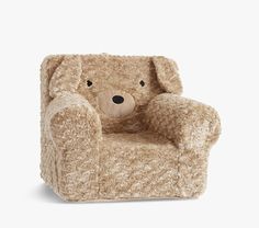 a teddy bear sitting in a chair with its eyes closed