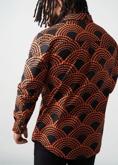 Style#: M2106 Meet the classic fall flannel's cousin, the Mazi Men's African Print Button-Up Shirt. The Black Amber Dots print gives all the fall vibes with an African twist. Features: Slightly rounded hem 97% Cotton/3% Lycra Stretch Poplin printed body, sleeves and patch pocket at chest 97% Cotton/3% Lycra Stretch Poplin Contrast Fabric at the Welt Pocket, Hidden Placket, and the Inner Sleeve Cuff Designed in the USA, imported Care Instructions: Machine wash cold on a gentle cycle with non-chlo Fall Flannel, Sleeve Cuff, Mens Fall, Printed Bags, Fall Collections, Workout Accessories, Dot Print, Swimwear Accessories, Womens Fall