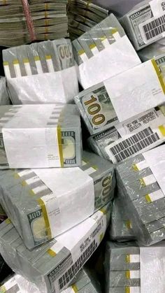 stacks of $ 100 bills wrapped in plastic bags