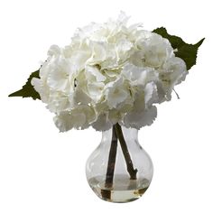 a vase filled with white flowers on top of a table