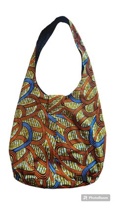 Hobo Bag - Blue or Orange African Print Bag *HOW I CREATED THIS BAG: Our aim is to bring you eco-friendly shopping bags that can be used again and again. This bag is made with genuine African Print 100% cotton fabric. The bag is expertly sewn together making this bag strong and sturdy.  This tote bag is lightweight but also sturdy enough to carry books or shopping.  When the bag is not in use it can be easily rolled up  Features: *Made of 100% African Print cotton *Sustainable, renewable and bio Versatile Rectangular Reusable Bag, Versatile Rectangular Reusable Bags, Blue Reversible Shoulder Bag With Double Handle, Reversible Blue Shoulder Bag With Double Handle, Blue Hobo Bag With Removable Pouch, Reversible Bucket Bag For Shopping, Eco-friendly Hobo Shoulder Bag For Shopping, Reusable Tote Bag For Market, Blue Reversible Tote Shoulder Bag