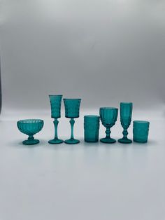 a group of green glasses sitting next to each other