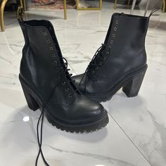 Stylish Heeled Combat Boots, Perfect For Someone Who Likes Being Fashionable And Comfortable, Brand New Dr Martens Black Leather Combat Boots With Block Heel, Edgy Heels For Workwear, Lace-up Heeled Boots With Stacked Heel, Edgy Round Toe Heels For Work, Edgy Round Toe Heels For Workwear, Black Lace-up Boots With Reinforced Block Heel, Black High Heel Lace-up Boots For Work, Black Combat Boots With Reinforced Block Heel, Heeled Combat Boots