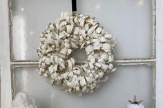 a wreath is hanging on the wall next to other decorations