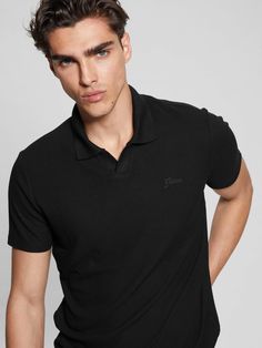 Polo shirt Rib knit construction Split neckline with folded collar Embroidered chest logo Short sleeves 48% Viscose/Rayon, 47% Polyester, 5% Elastane/Spandex Black Business Casual Top With Ribbed Collar, Black Ribbed Collar Top For Business Casual, Black Tops With Ribbed Collar For Business Casual, Black Top With Ribbed Collar For Business Casual, Fitted Collared Tops With Ribbed Neckline, Fitted Collared Top With Ribbed Neckline, Fitted Tops With Ribbed Collar For Business Casual, Ribbed Collared Top For Business Casual, Collared Ribbed Top For Business Casual