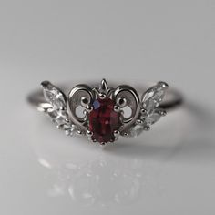 An upgraded version of the round cut ring of wisdom, this ring features a gorgeous 0.75 carat round cut pink sapphire. Gothic Engagement Ring Victorian, Goth Engagement Ring, Alt Wedding Rings, Wed Rings, Magical Elements, Sailor Moon Anime, Beau Crochet, Queen Rings, Edgy Jewelry