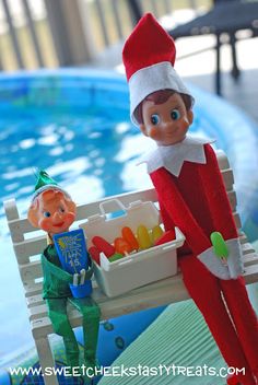 an elf is sitting on a bench by the pool