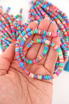 Delightfully bright and colorful, these heishi beads give off strong summer vibes. Their organic heishi shape makes them comfortable against the skin, and perfect for making beach bracelets and neckalces.The DetailsSize: Approx. 6x3mmApprox. Drilled Hole Size: 1mmMaterial: Dyed Mother of Pearl ShellColors: Assorted shades of Pink, Coral, Green, Blue, PeriwinkleStrand Length: 15.5"❤️✌🏽❤️✌🏽❤️✌🏽❤️All content (which includes all text, photography, product names, product descriptions) is All right Multicolor Heishi Beaded Bracelets For Vacation, Bohemian Heishi Letter Beads, Beach Heishi Beaded Necklace With Letter Beads, Bohemian Heishi Heart Beads, Rainbow Heishi Beads Necklace, Hand-strung Heishi Beaded Necklaces For Beach, Hand-strung Heishi Beads Necklace For Beach, Colorful Heishi Letter Beads, Colorful Heishi Beads Jewelry For The Beach