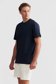 Introducing your new wardrobe staple, the Henderson T-Shirt. A versatile, 100% cotton Tee that pairs effortlessly with any outfit. Crafted in a relaxed fit, designed for everyday wear. 100% Mid weight cotton Navy garment wash Ribbed neckline Designed in Australia. Made in China Classic Relaxed Fit T-shirt For Loungewear, Classic Crew Neck T-shirt For Loungewear, Classic Everyday T-shirt In Pima Cotton, Classic Everyday Pima Cotton T-shirt, Modern Relaxed Fit Cotton Tops, Modern Cotton Top With Relaxed Fit, Cotton Jersey T-shirt For Everyday Summer Wear, Basic T-shirt For Casual Gatherings, Basic T-shirt With Relaxed Fit For Casual Gatherings